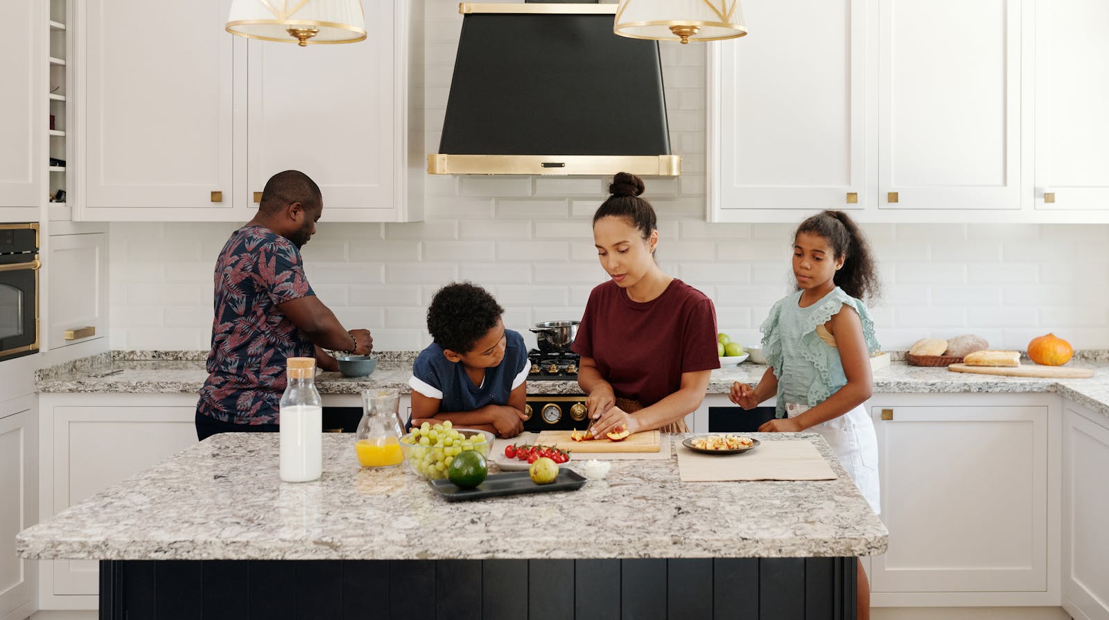 Family preparing fresh food together in a bright kitchen